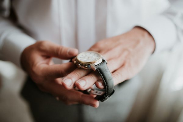 Businessman Checking Time On His Wrist Watch Man Putting Clock On Handgroom Getting Ready In The Morning Before Wedding Ceremony 1224896693 5472x3648 Scaled 600x400